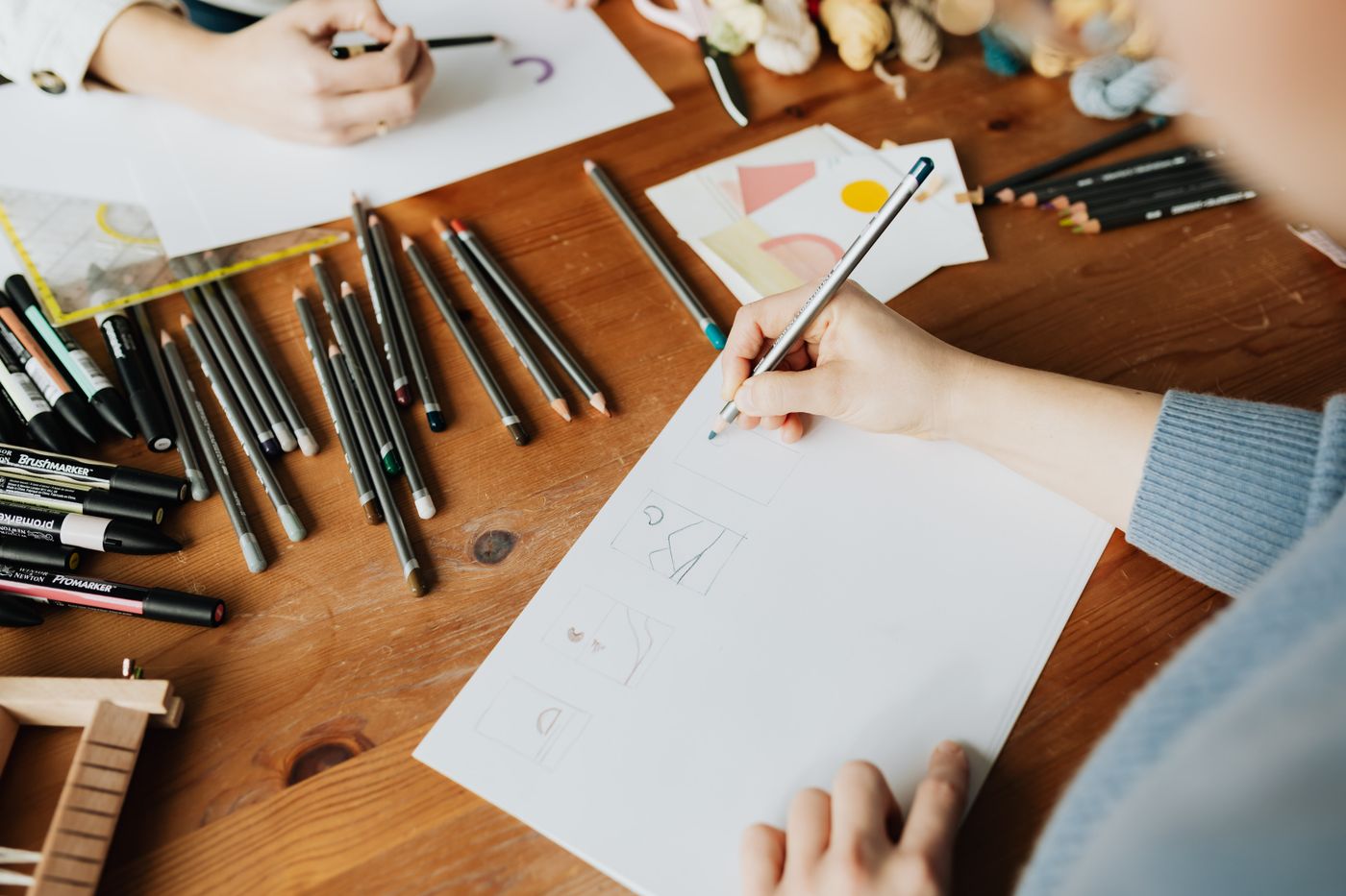 Designer sketching ideas on paper