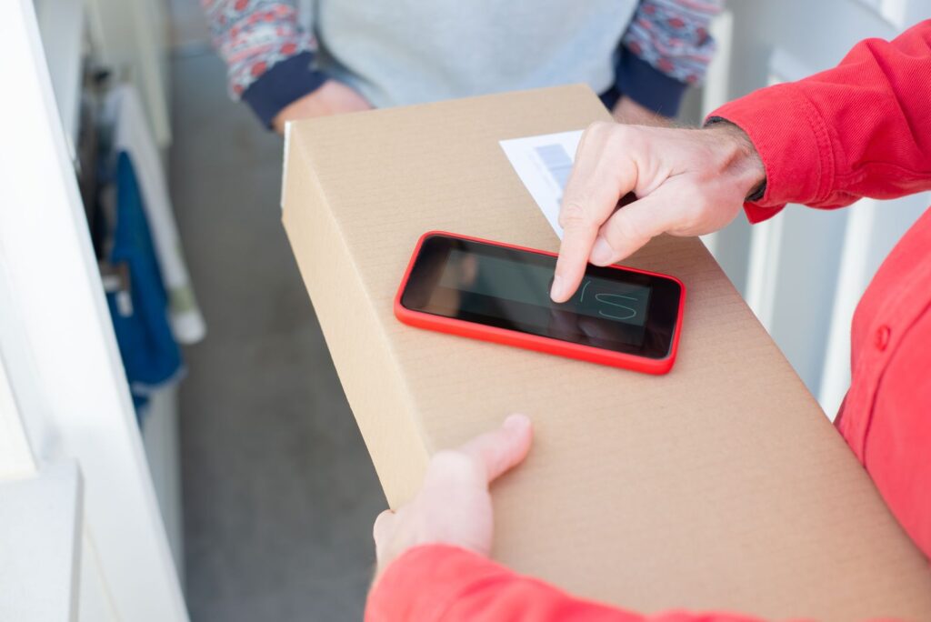 Customer signing for an online shopping delivery on a smartphone