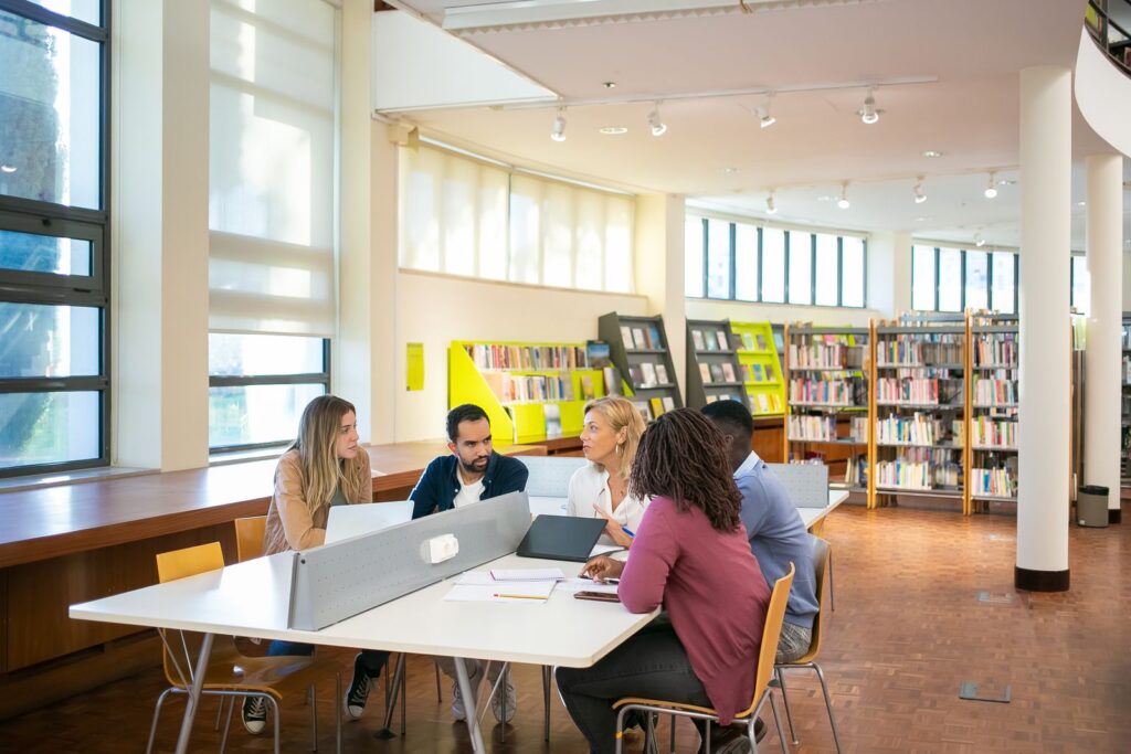 University students researching together in a library