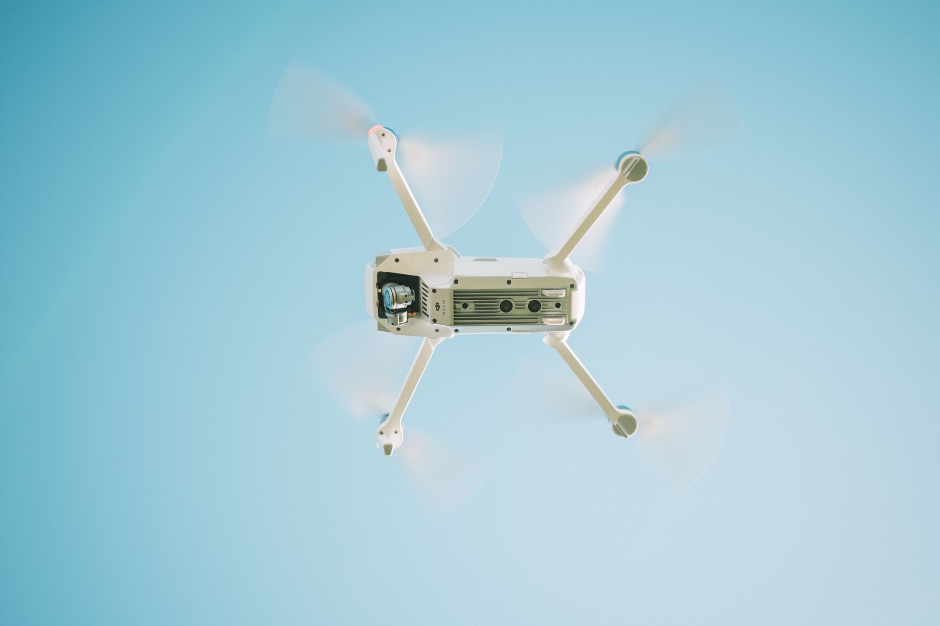 White drone flying in the sky