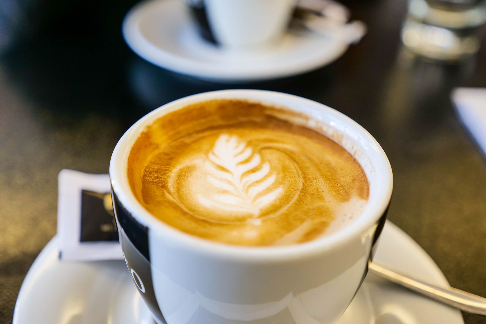 Cappuccino with latte art in a cafe