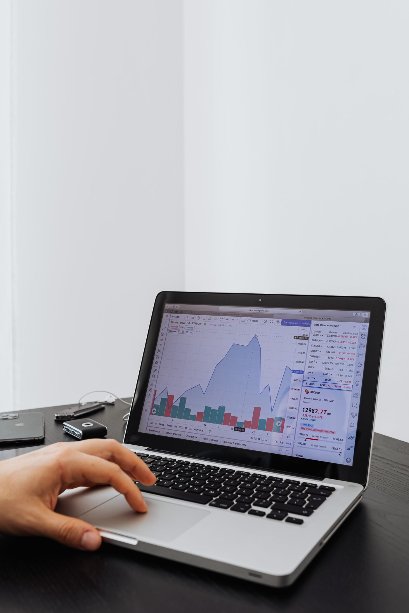 Person analysing performance data on a laptop