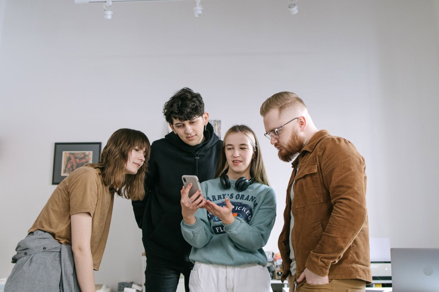 Friends looking at a phone together
