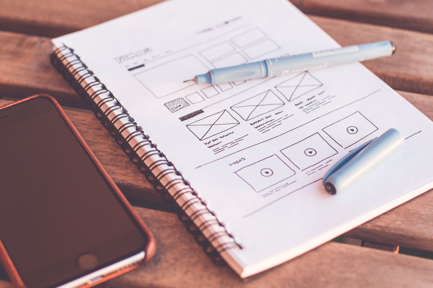 UX wireframe sketches in a notebook
